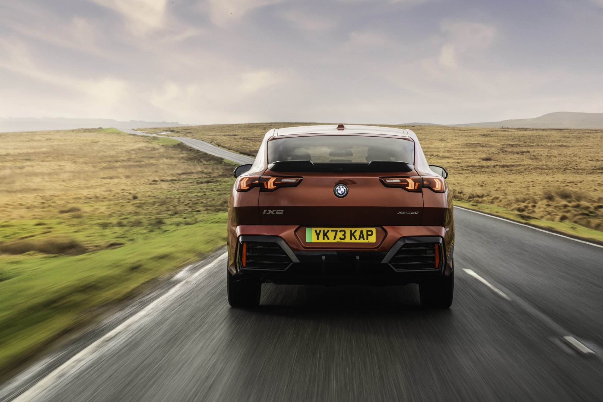 iX2 driving away