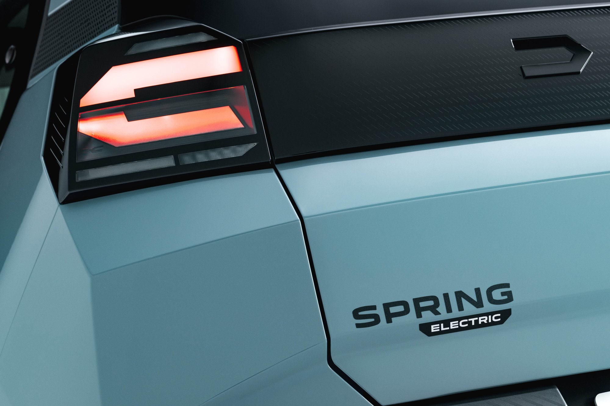 The Spring Electric badge and the tail light