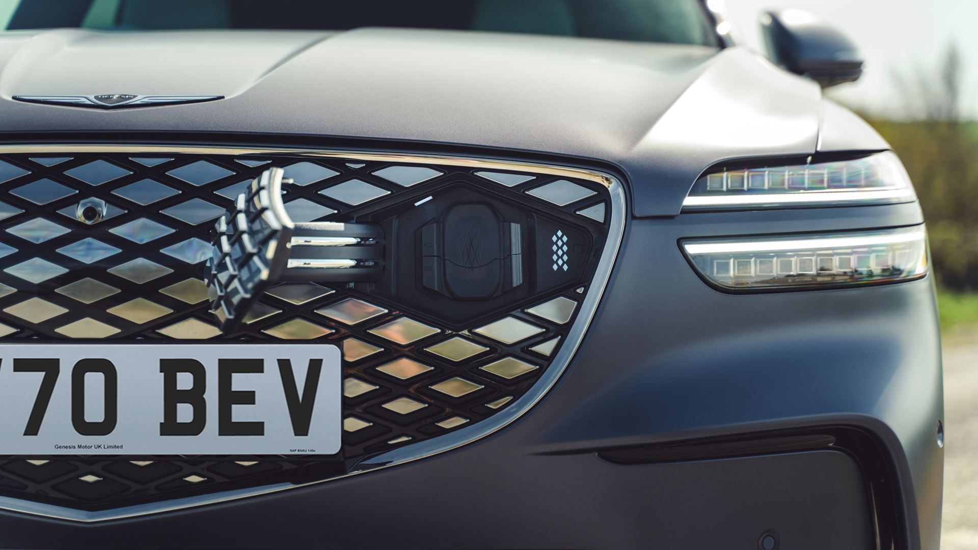 The Electrified GV70's charging port, hidden in the grille