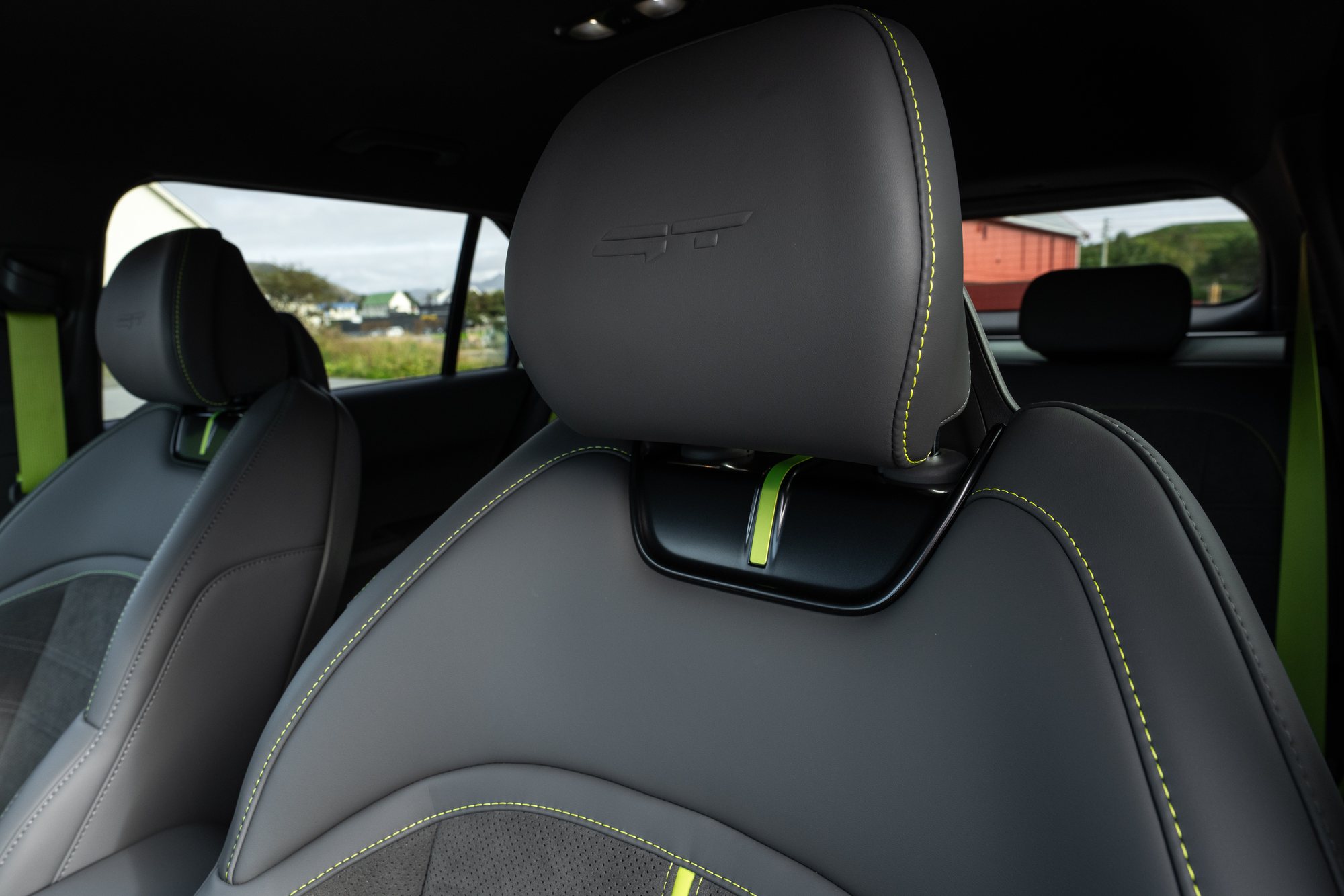 The semi-bucket sports seats, in suede with neon-green stitching