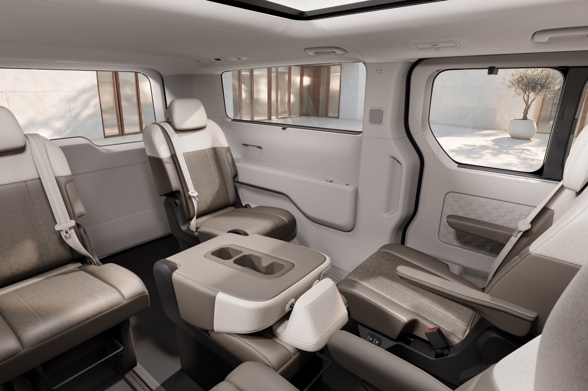 Behind the front seats, with the console folded out as a table