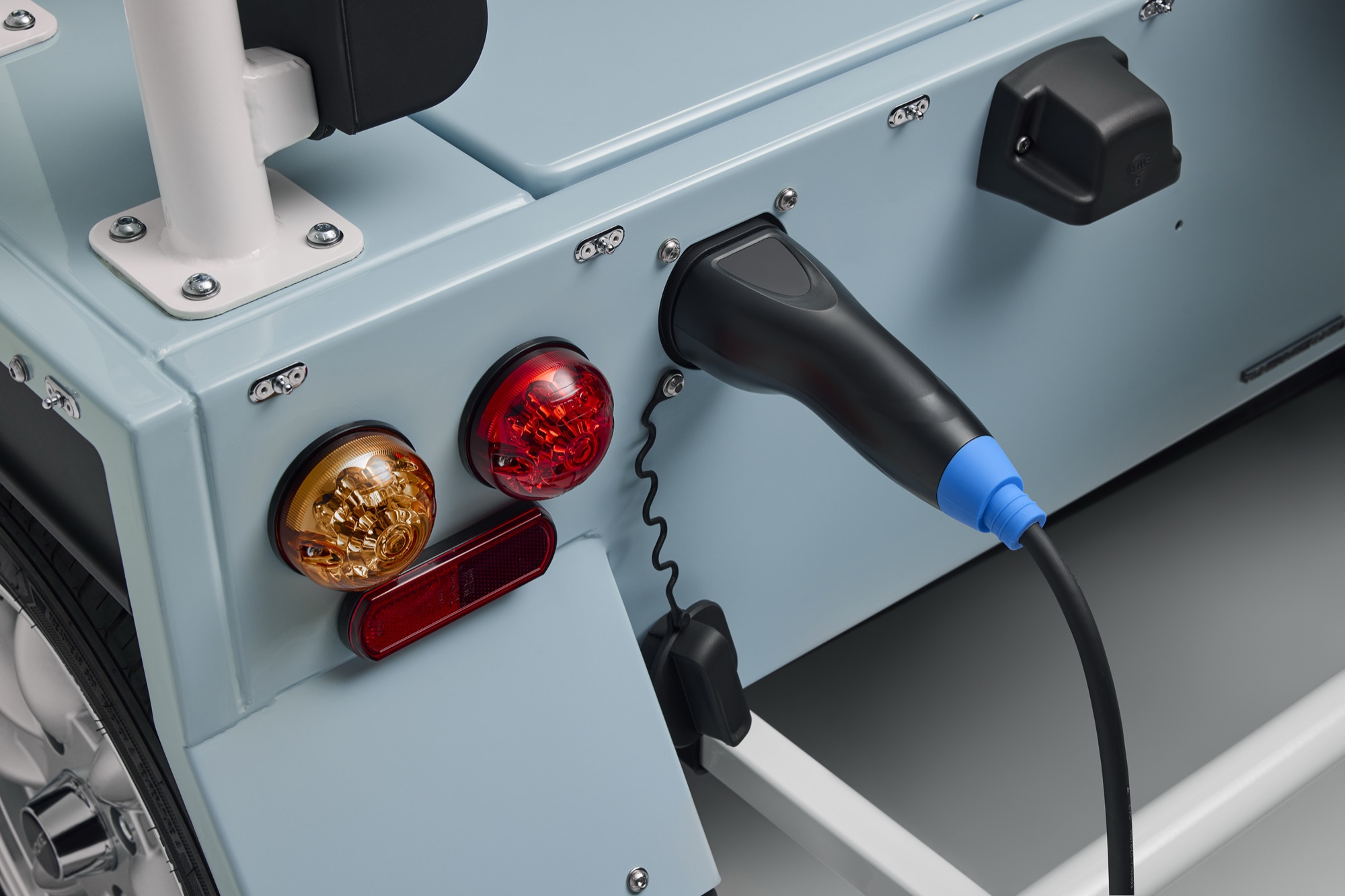 The charging port, moved to the back on the Mk2. A prototype, so the production car may differ