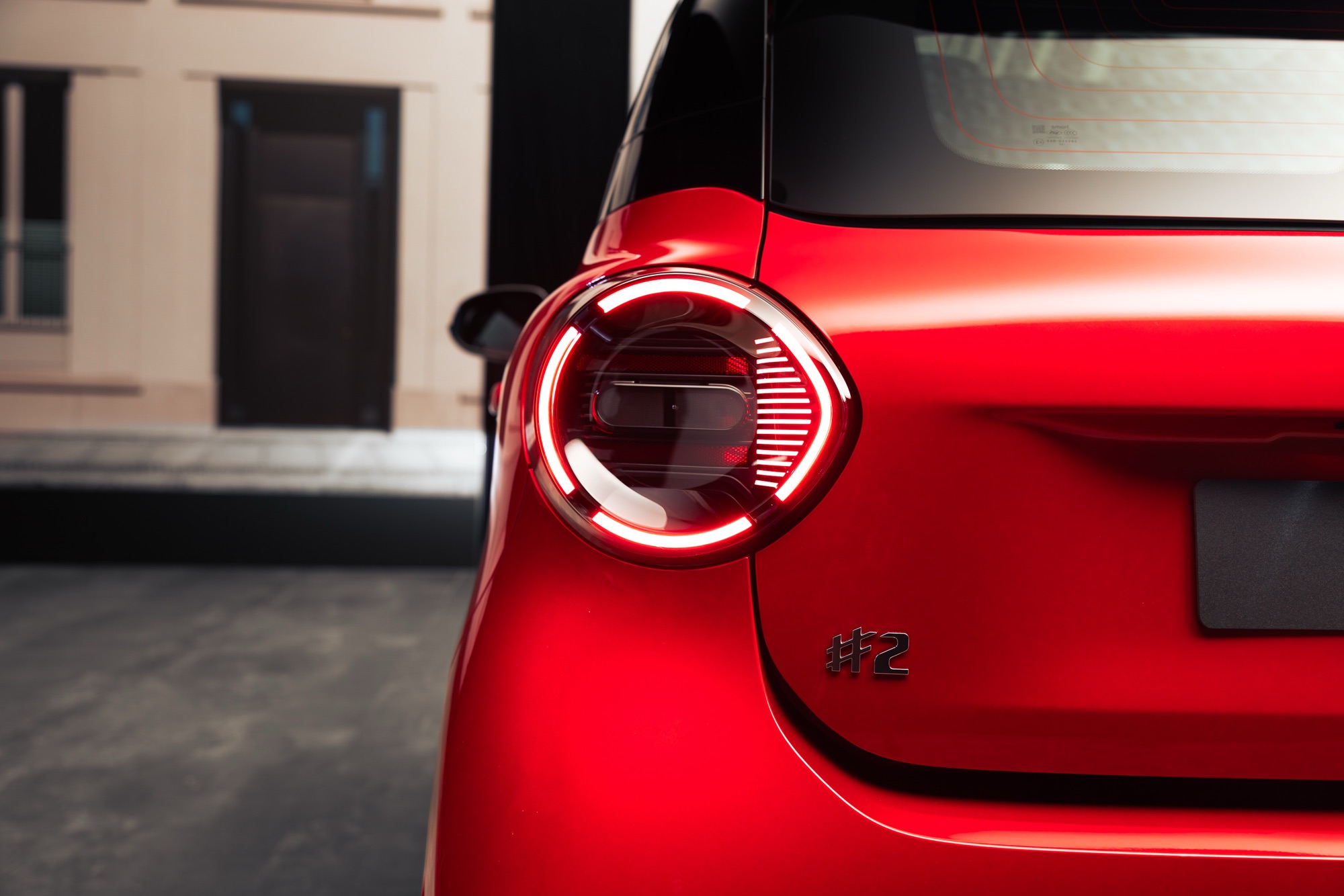 The round tail light, and the #2 badge below it