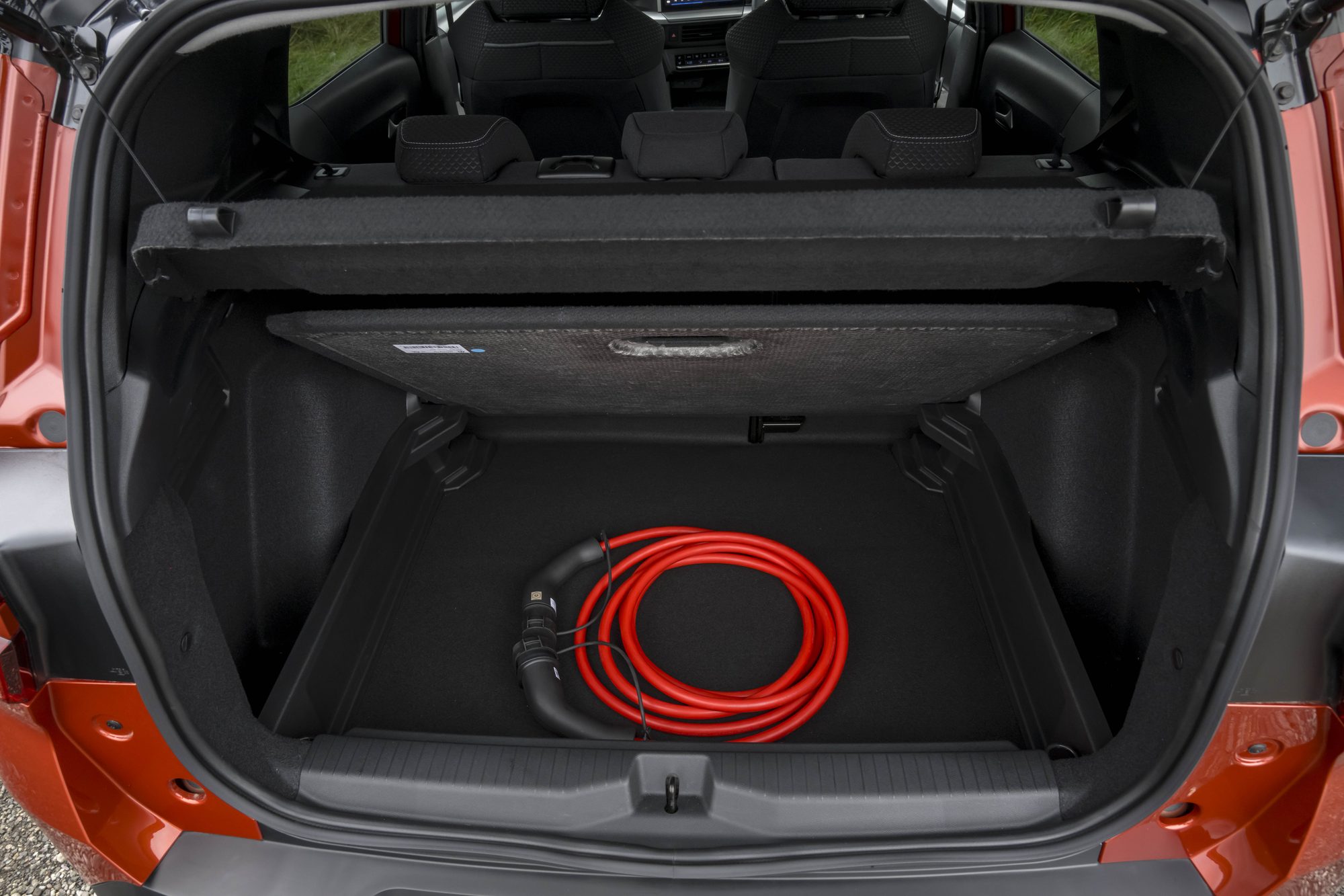 The charging cable stowed in the Frontera's boot