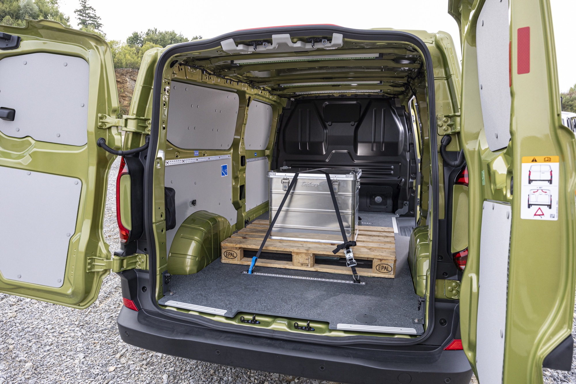 The load area through the rear wing doors, with a Euro pallet