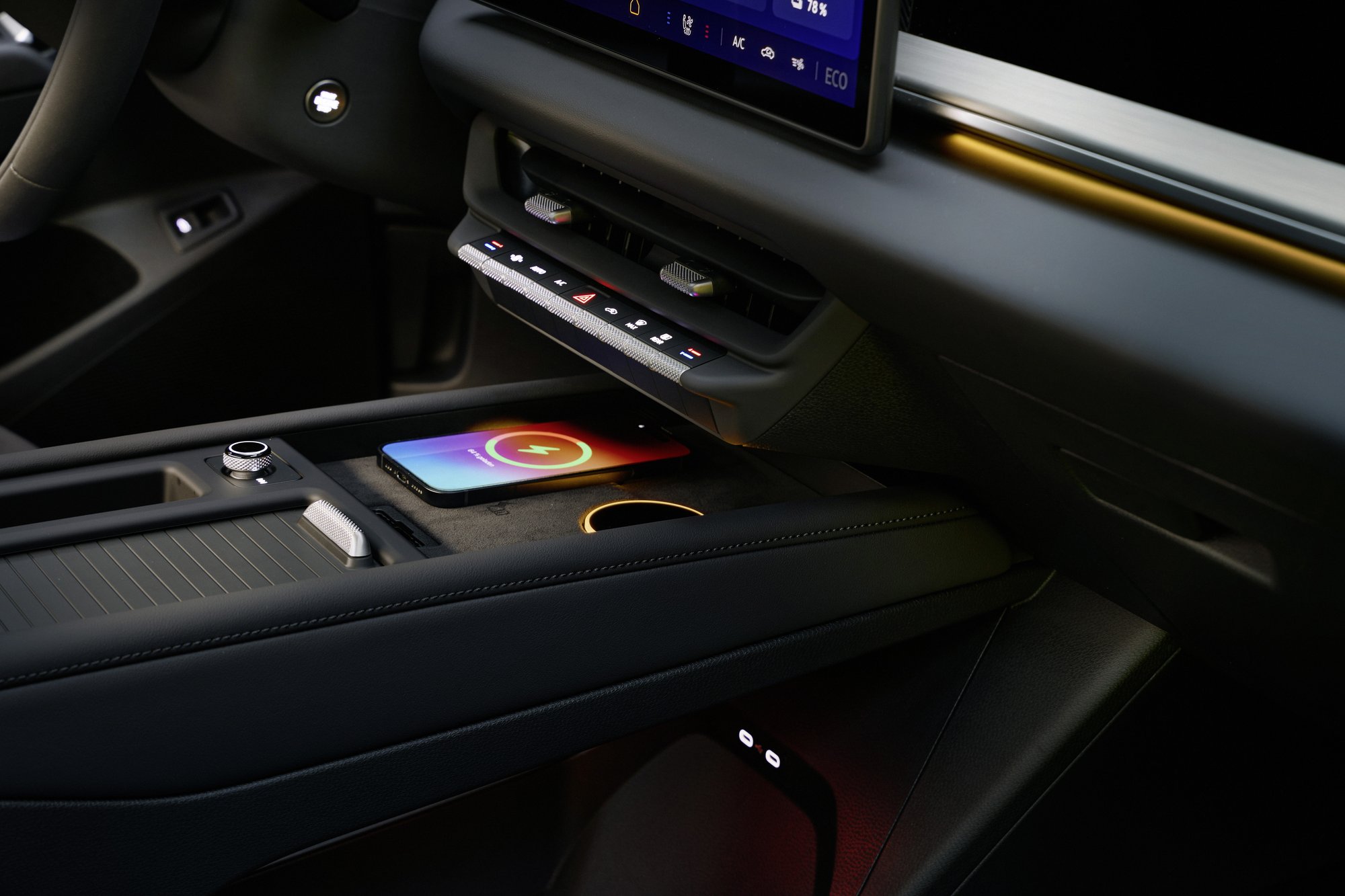 Two Qi2 phone chargers and the volume dial